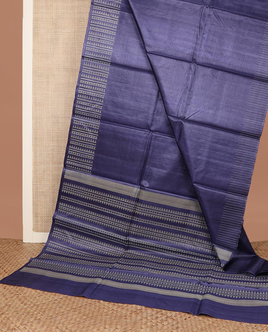 Blue plain tussar silk saree, self border and pallu features geometric patterns, and temple motifs