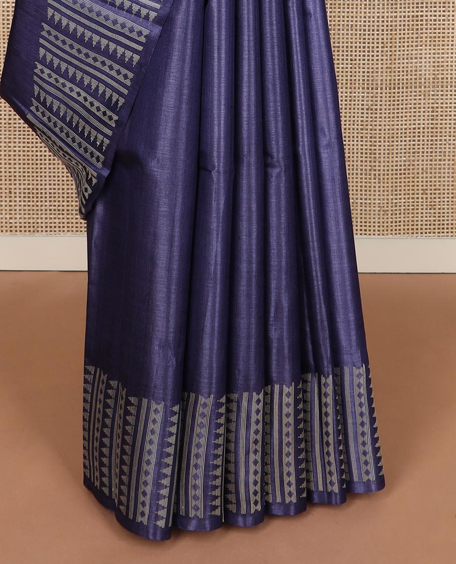 Blue plain tussar silk saree, self border and pallu features geometric patterns, and temple motifs