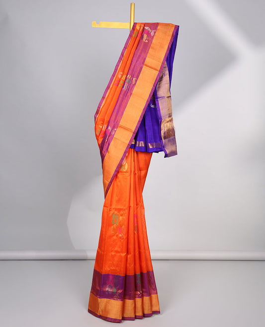 Organge floral buttas uppada silk saree with contrast plain border & floral , zari design pallu