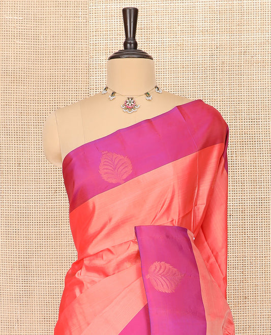 Peach Semi Uppada Saree Adorned with Zari Buttas, Complemented by a Contrasting Border of Leaf Buttas, Richly Woven Pallu Steeped with Chakram Designs, and Paired with a Contrast Blouse