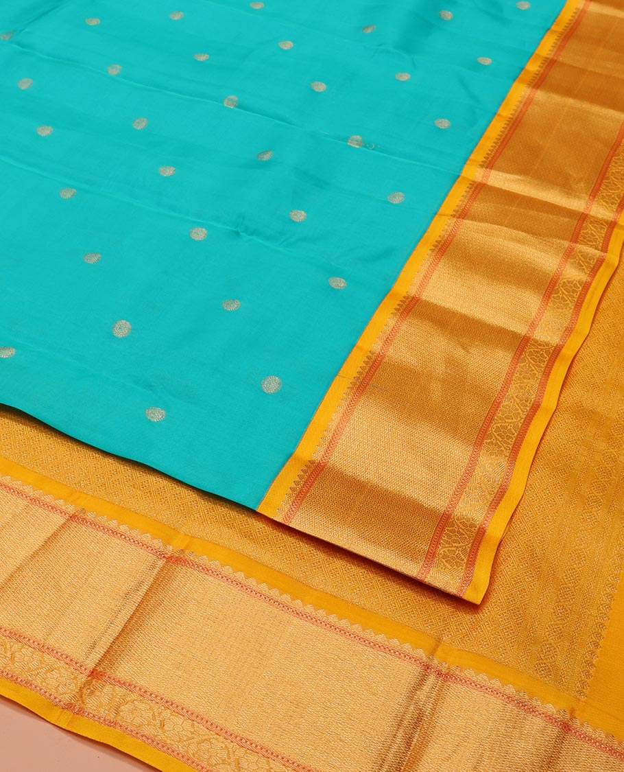 Blue Vasundhara Lite-Silk Mix Saree, Mesmerized with Zari Buttas All Over Its Body, Complemented by Contrast Border Featuring Thilakam Mokku, Muthu, Mayil Kann, and Kodi Visiry Designs, Grand Jaal Pallu, and Paired with a Contrast Blouse