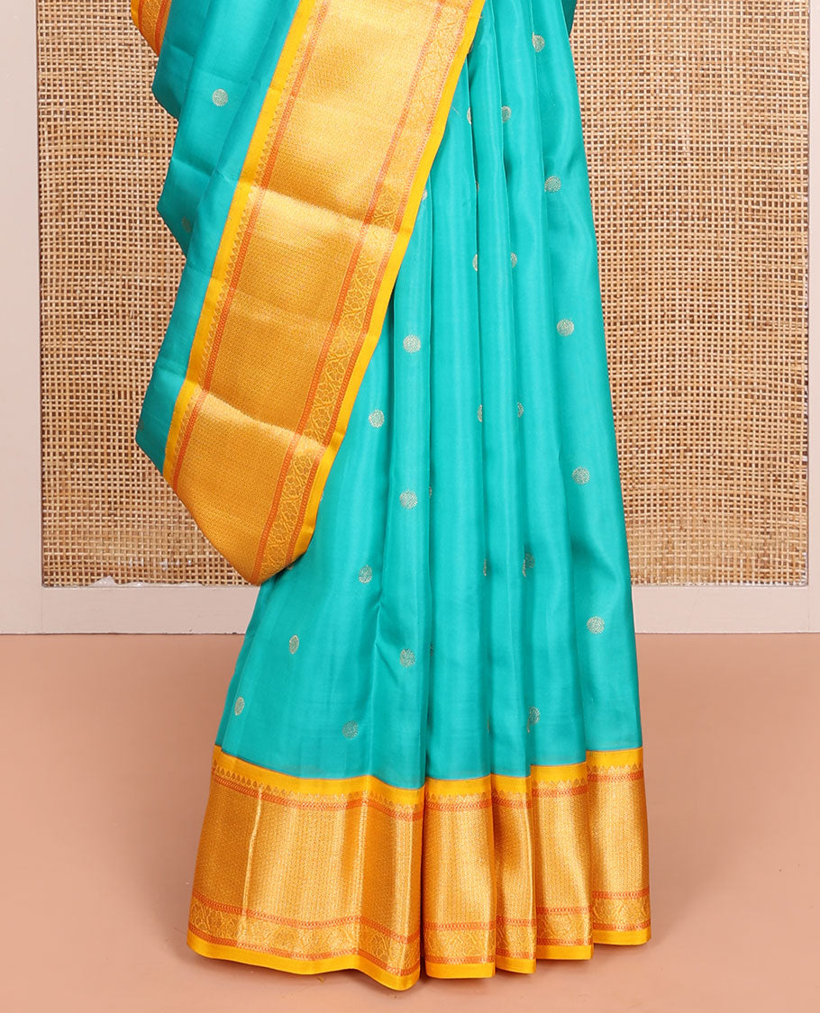 Blue Vasundhara Lite-Silk Mix Saree, Mesmerized with Zari Buttas All Over Its Body, Complemented by Contrast Border Featuring Thilakam Mokku, Muthu, Mayil Kann, and Kodi Visiry Designs, Grand Jaal Pallu, and Paired with a Contrast Blouse
