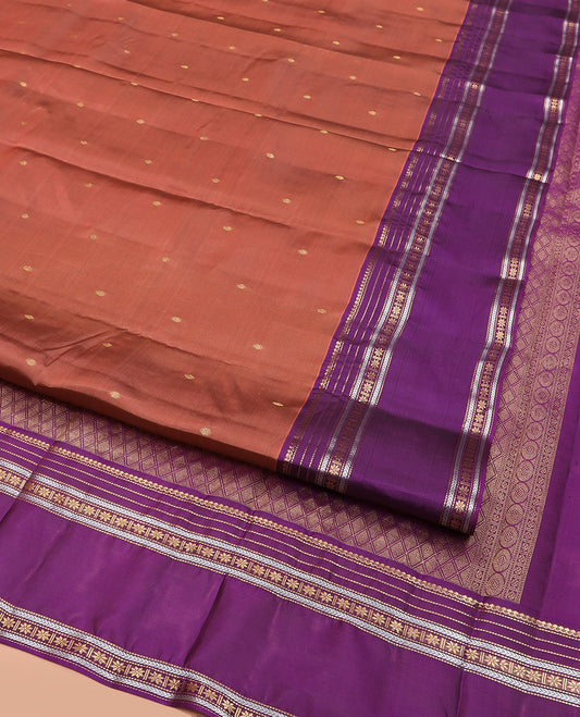 Rust Vasundhara Lite Silk Mix Saree Adorned with Rudraksham Buttas, Complemented by Contrast Varisai Pettu Border of Thilakam Mokku, Muthu, Kathir, and Star Vanki Designs, Pallu of Jaal Designs, and Paired with a Contrast Blouse