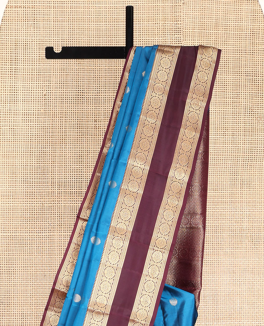 Blue Vasundhara Lite Silk Mix Saree, Adorned with Chakram Buttas All Over Its Body, Complemented by a Contrast Rettai Pettu Border of Rekku, Neli, and Chakram Designs, Pallu of Chakram and Jaal Designs, and Paired with a Contrast Blouse