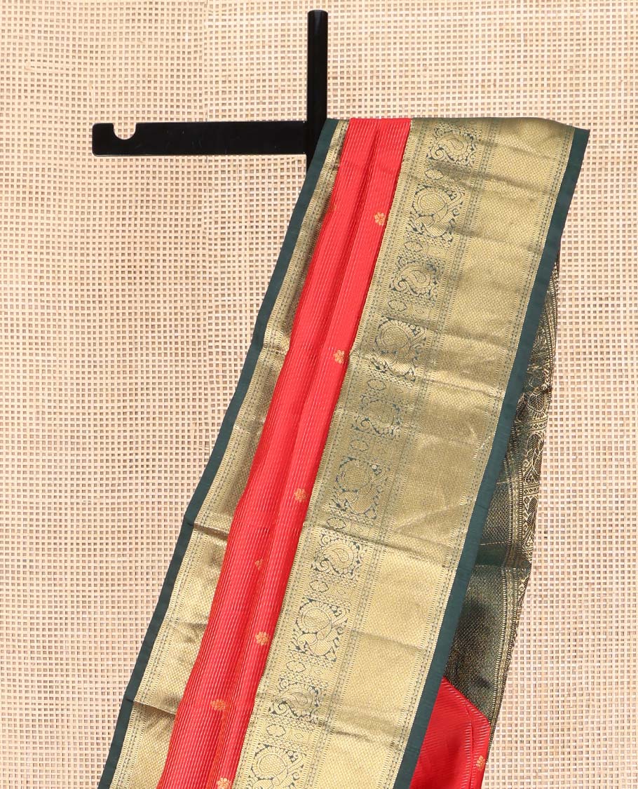 Red Vasundhara Lite Silk Mix Saree, Delicately Woven with Zari Buttas and Stripes, Complemented by a Contrast Border of Rekku, Muthu, Mayil, and Mayil Kann Designs, Pallu Steeped with Peacock Feather-Like Designs, and Paired with a Contrast Blouse