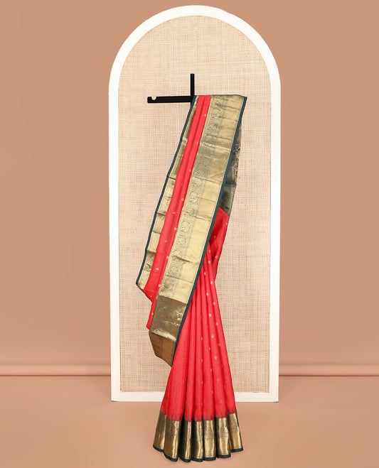Red Vasundhara Lite Silk Mix Saree, Delicately Woven with Zari Buttas and Stripes, Complemented by a Contrast Border of Rekku, Muthu, Mayil, and Mayil Kann Designs, Pallu Steeped with Peacock Feather-Like Designs, and Paired with a Contrast Blouse