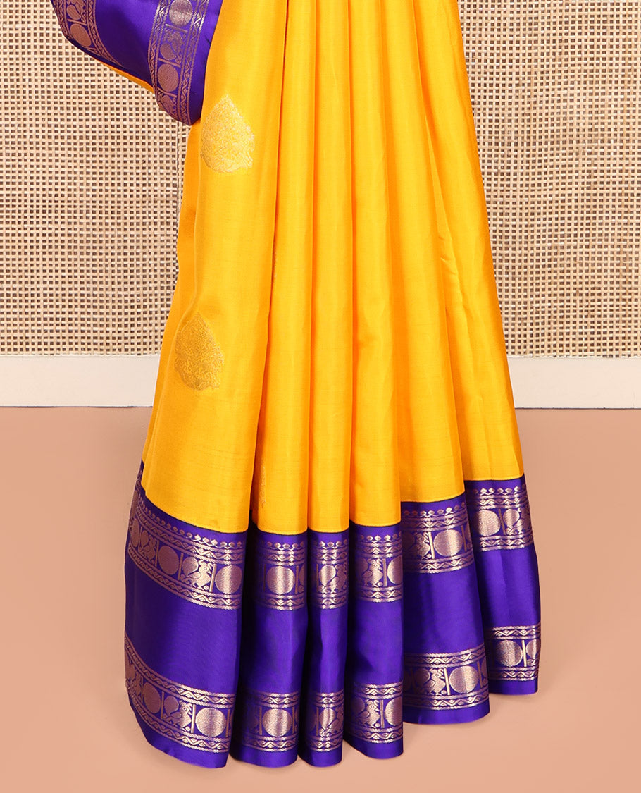 Yellow Vasundhara Lite-Silk Mix Saree, Sparsely Woven with Zari Buttas, a Contrast Rettai Pettu Border of Mayil and Rudraksham Design, Intricately Designed Pallu, and a Contrast Blouse