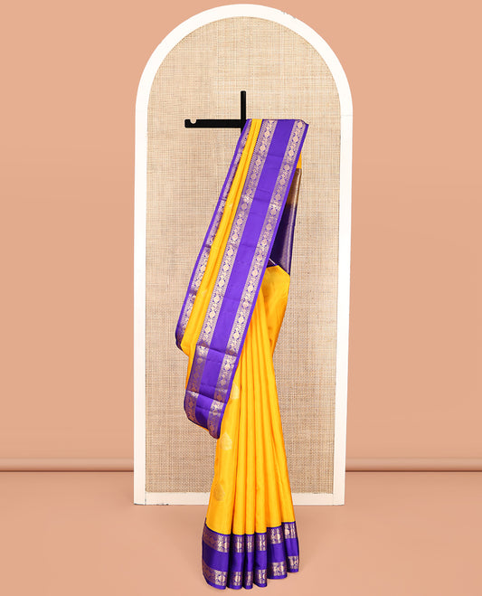 Yellow Vasundhara Lite-Silk Mix Saree, Sparsely Woven with Zari Buttas, a Contrast Rettai Pettu Border of Mayil and Rudraksham Design, Intricately Designed Pallu, and a Contrast Blouse