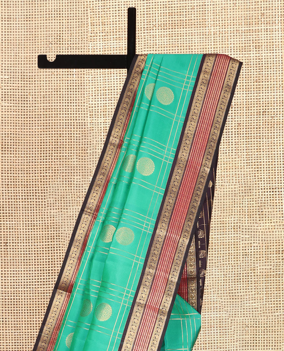 Green Vasundhara Lite Silk Mix Saree Features Butta Enclosed Checks, a Contrast Manga Design Border, Mayil-Chakram Pallu, and Contrast Blouse