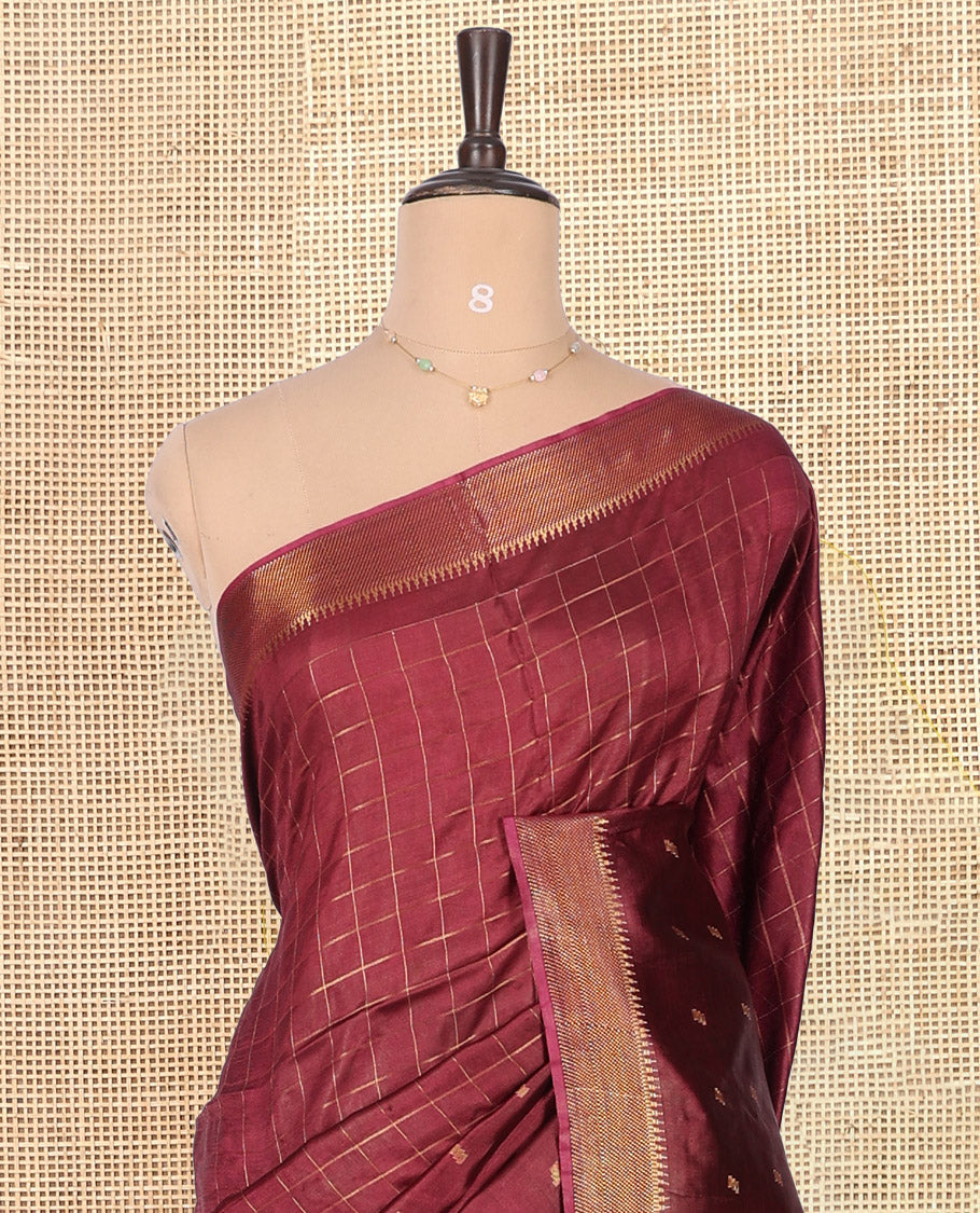 Maroon Banana Pith Saree, Gleamed Up with Checks and Buttas, a Zari Temple Border, Striped Pallu, and Matching Blouse