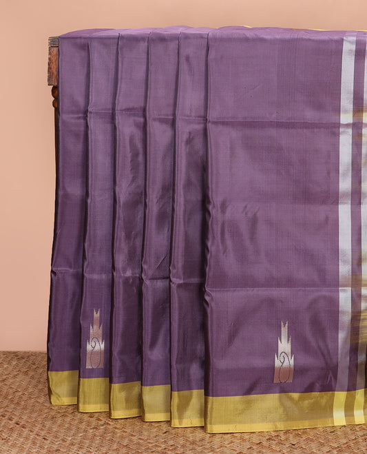 Purple buttas, and temple buttas Banana pith saree, contrast plain border, and contrast temple and paisley design pallu