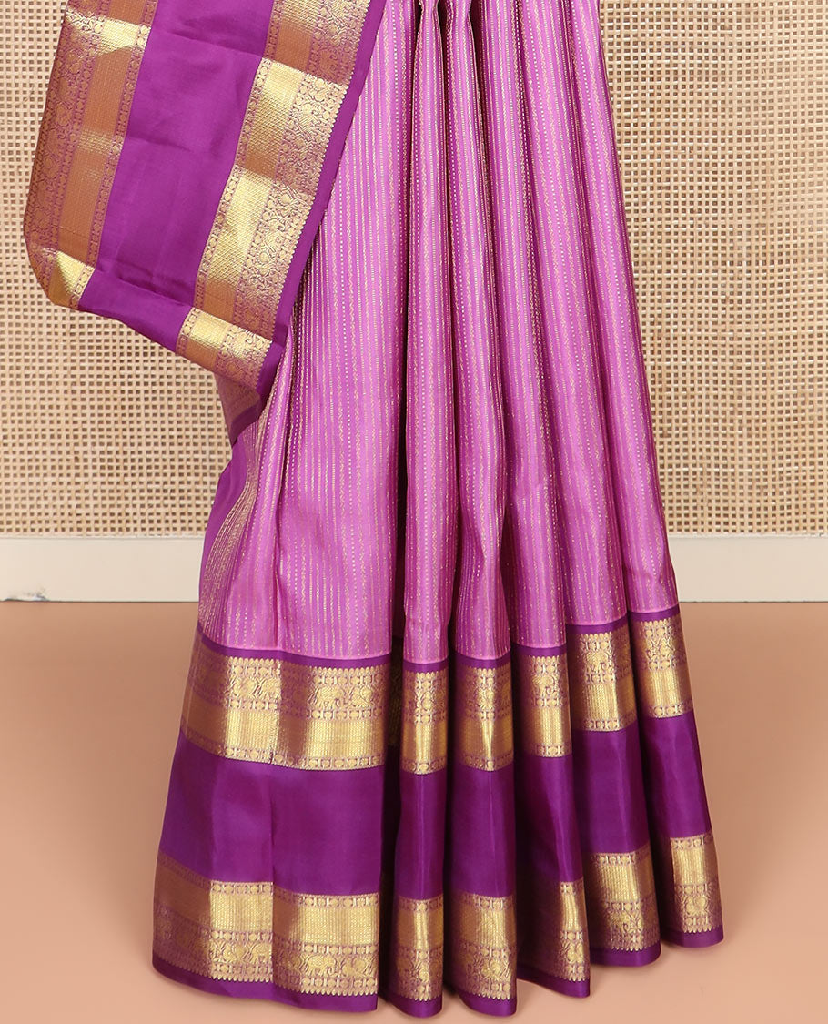 Pink Vasundhara Silk Saree Accentuated with Zari Stripes, Complemented by a Contrast Border of Salangai, Rudraksham, Star, Kodi Mayil, Yaanai, and Mayil Kann Designs, Pallu Decked Up with Traditional Designs, and Paired with a Contrast Blouse