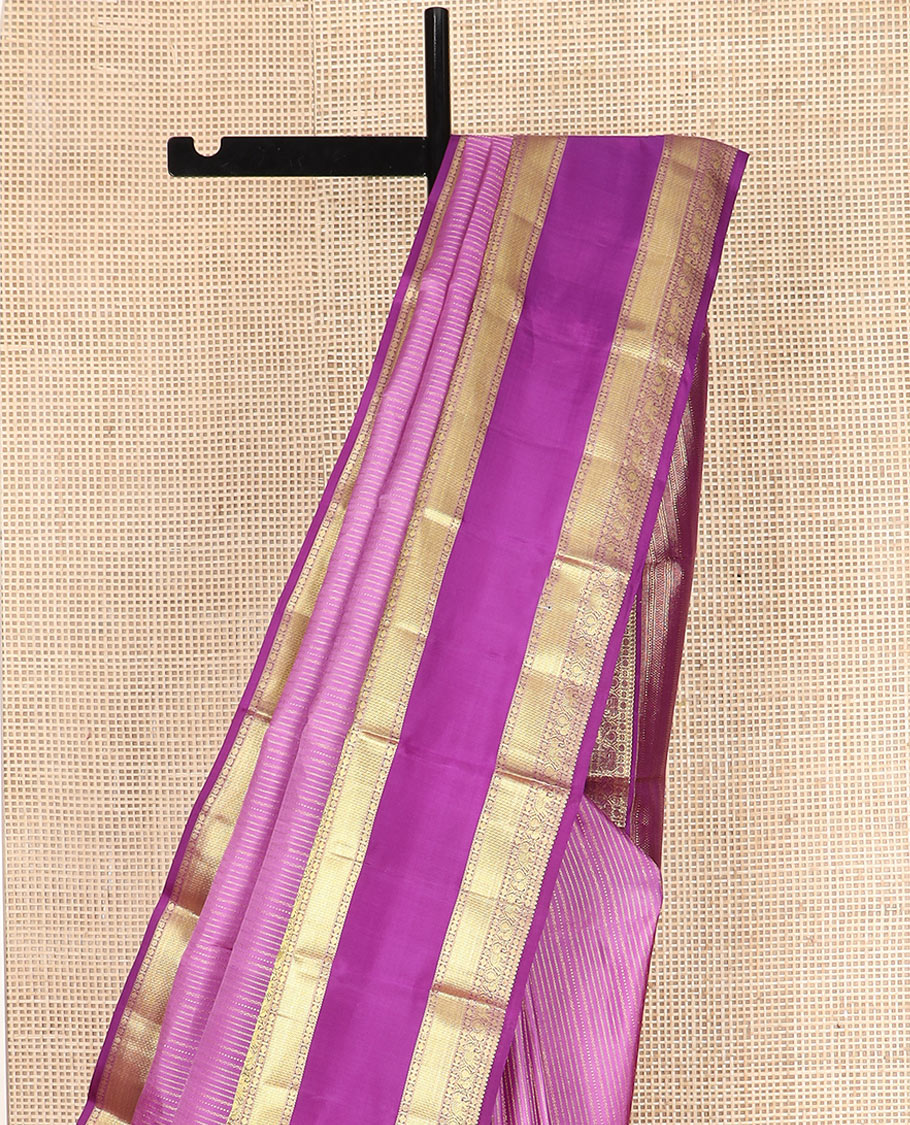 Pink Vasundhara Silk Saree Accentuated with Zari Stripes, Complemented by a Contrast Border of Salangai, Rudraksham, Star, Kodi Mayil, Yaanai, and Mayil Kann Designs, Pallu Decked Up with Traditional Designs, and Paired with a Contrast Blouse
