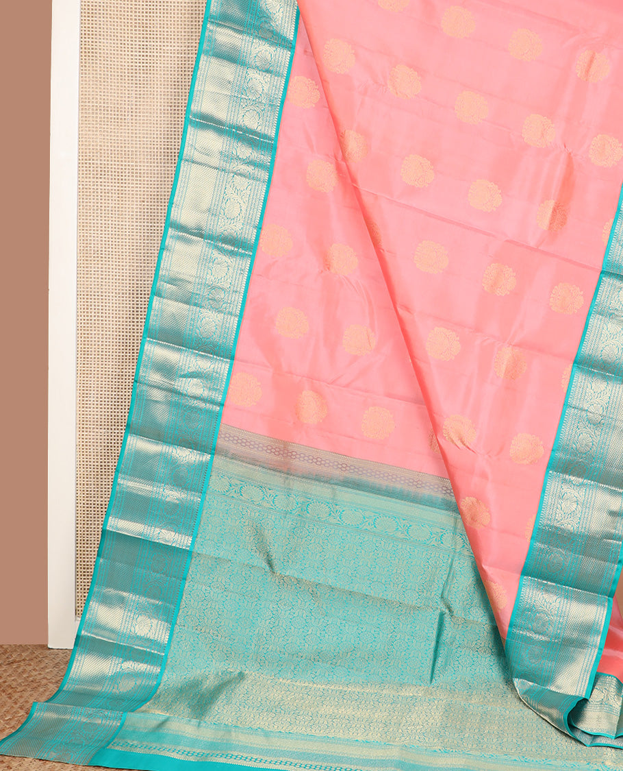 Pink zari buttas silk saree, contrast border of thilakam mokku, muthu, lavangam, kodi visiry, and kuyil kann designs, and chakram motifs steeped pallu