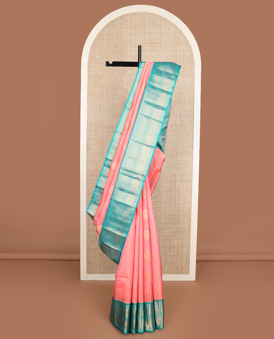 Pink zari buttas silk saree, contrast border of thilakam mokku, muthu, lavangam, kodi visiry, and kuyil kann designs, and chakram motifs steeped pallu