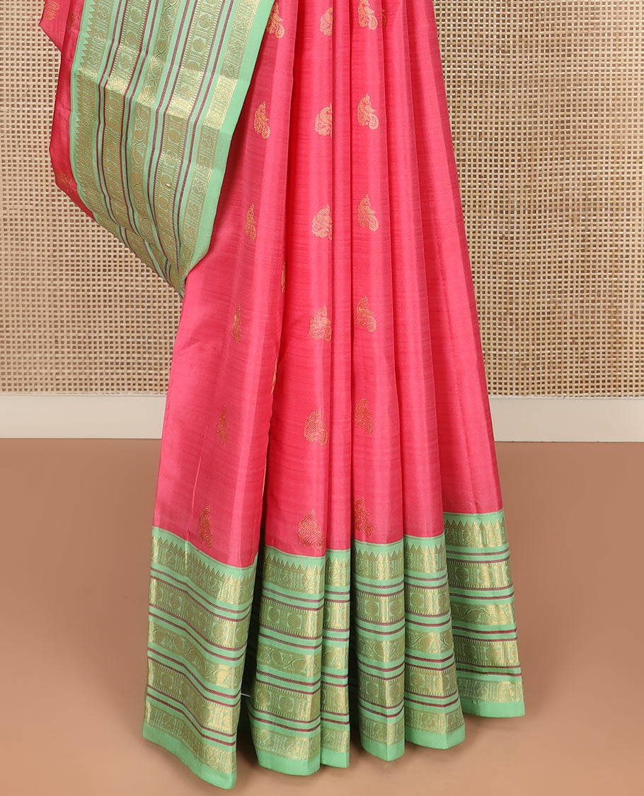Red Vasundhara Silk Saree Subtly Woven with Zari Buttas, Complemented by a Contrast Varisai Pettu Border of Rekku, Mayil, Rudraksham, and Manga Designs, Pallu Adorned with Traditional Designs, and Paired with a Contrast Zari-Bordered Blouse