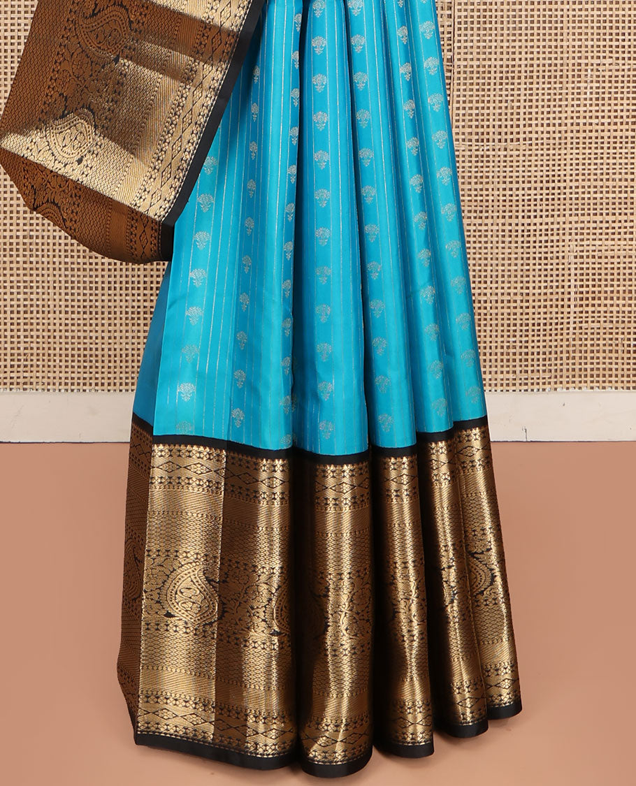 Blue Vasundhara Silk Saree, Adorned with Zari Buttas All Over Its Body, Complemented by Contrast Border of Rekku, Lavangam, Diamond, Mayil Kann, and Arumbu Manga Designs, Pallu of Mughal-Style Jaal Designs, and Paired with a Contrast Blouse