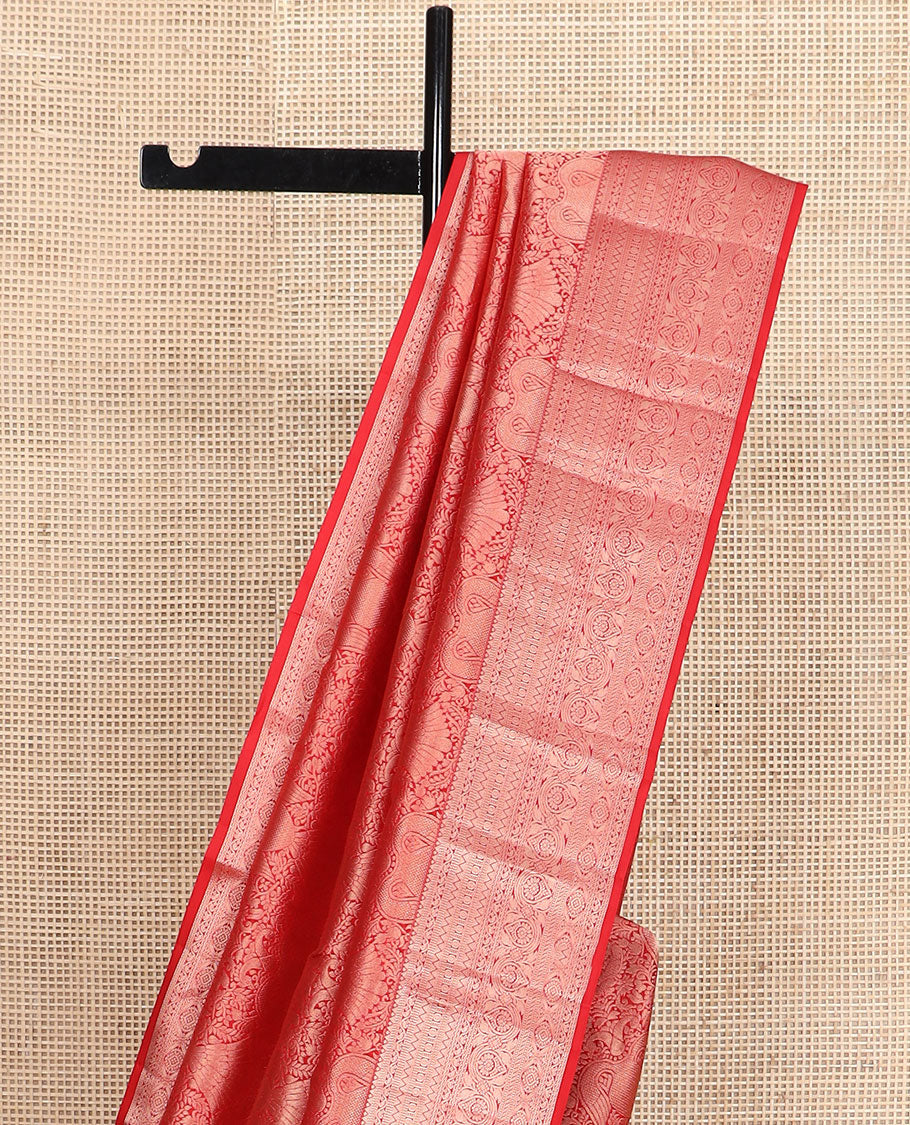 Orange iruthalai pakshi jacquard Kanchipuram wedding silk saree, zari traditional design border, and pallu of zari-rich jaal
