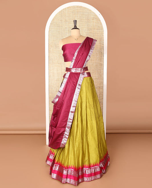 Green art-silk half-saree, plain with contrast temple traditional design bordered skirt, contrast blouse, and plain zari bordered dhavani