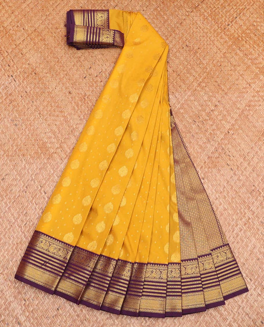 Yellow Budget Silk Saree, Adorned with Zari Buttas All Over Its Body, Complemented by a Contrast Traditional Zari Design Border, Grand Jaal Design Pallu, and Paired with a Contrast Blouse