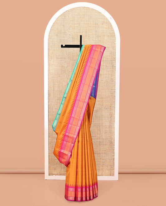Orange-Striped Bangalore Silk Saree, Complemented by a Contrast Temple Ganga-Jamuna Border, Pallu of Temple and Neli Designs, and a Contrast Blouse