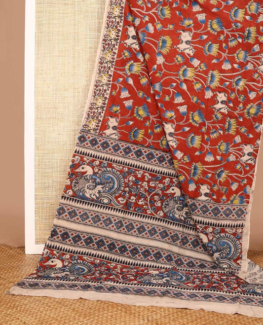 Terracotta red Pichwai and lotus designs machine-printed Kalamkari cotton saree, contrast Pichwai cows printed border, and pallu of temple, peacocks, and diamond designs