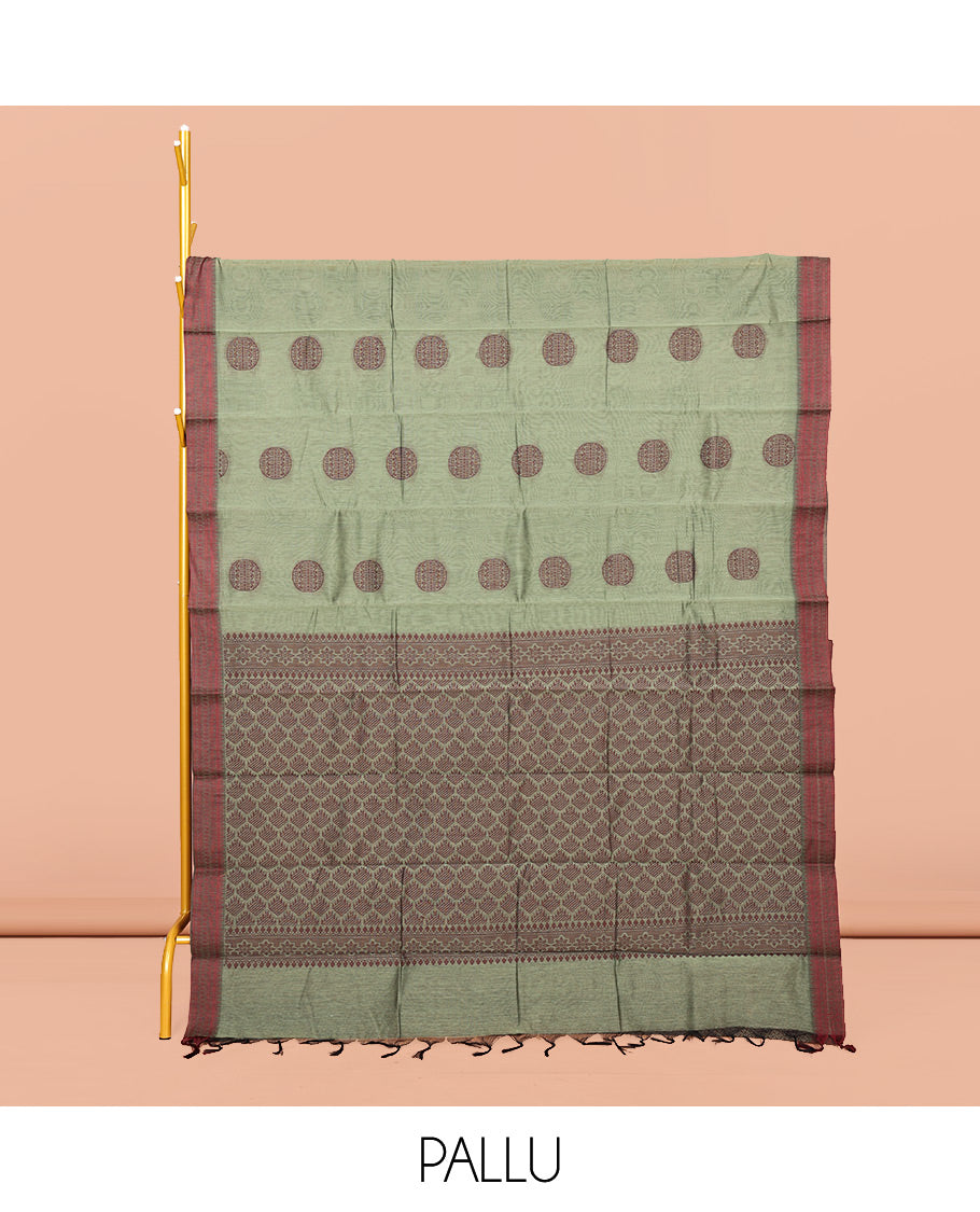Green Semi-Silk Cotton Saree, Adorned with Round Buttas on Its Body, Complemented by a Contrast Thread Traditional Motifs Woven Border, Jaal Design Pallu, and Paired with a Contrast Blouse