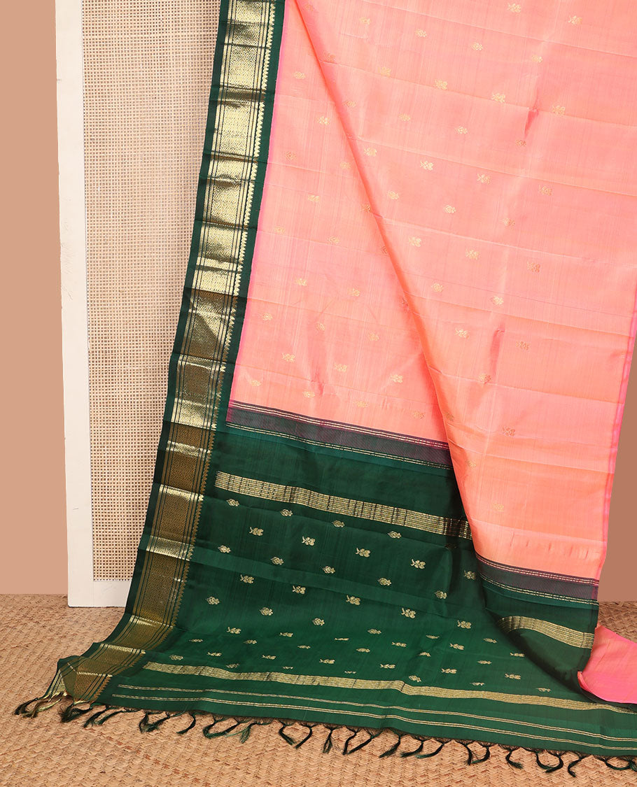 Peach zari buttas Kanchipuram silk saree, contrast korvai one-sided border of thilakam mokku, banaras, and jaal designs, and zari design pallu