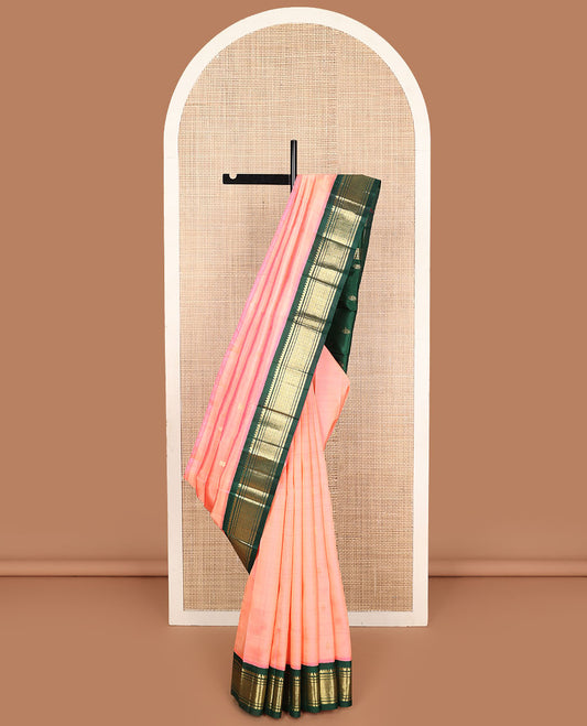 Peach zari buttas Kanchipuram silk saree, contrast korvai one-sided border of thilakam mokku, banaras, and jaal designs, and zari design pallu