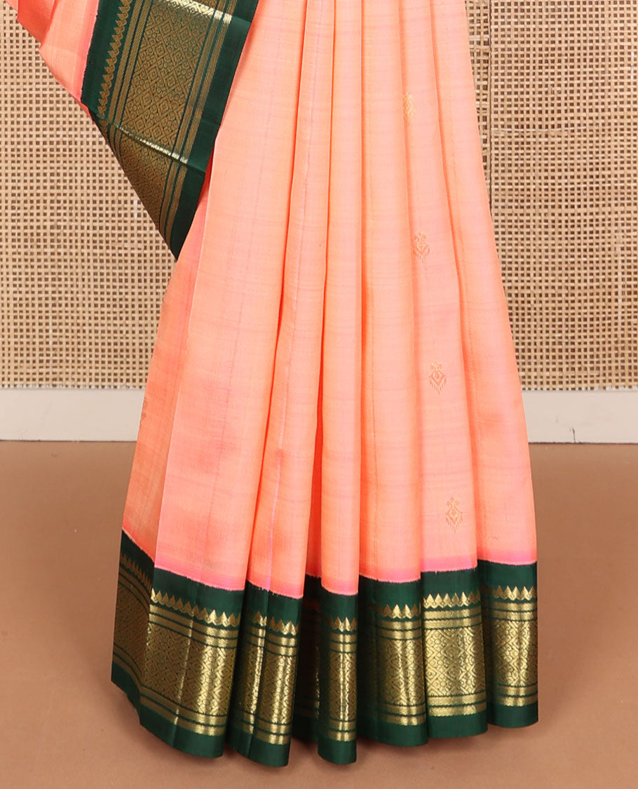 Peach zari buttas Kanchipuram silk saree, contrast korvai one-sided border of thilakam mokku, banaras, and jaal designs, and zari design pallu