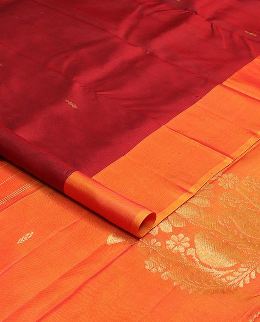 Red zari buttas Kanchipuram silk saree, contrast leaf buttas woven border, and pallu of floral designs