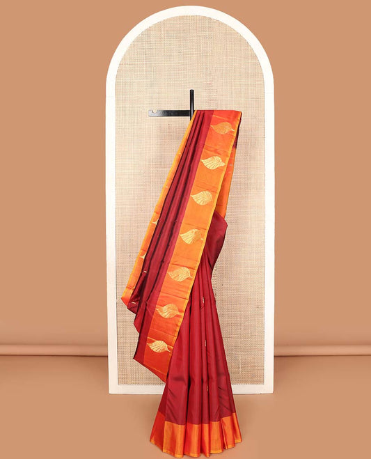 Red zari buttas Kanchipuram silk saree, contrast leaf buttas woven border, and pallu of floral designs