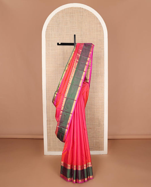 Pink striped Kanchipuram silk saree, contrast ganga jamuna rettai pettu border of manga, banaras, and mayil kann designs, and zari striped pallu
