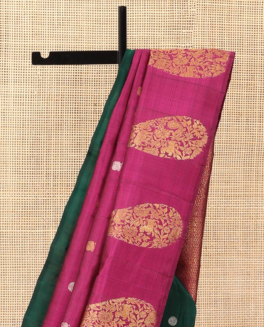 Borderless green and rani pink mayil chakram, and manga motifs Kanchipuram designer saree, zari-rich traditional designs pallu