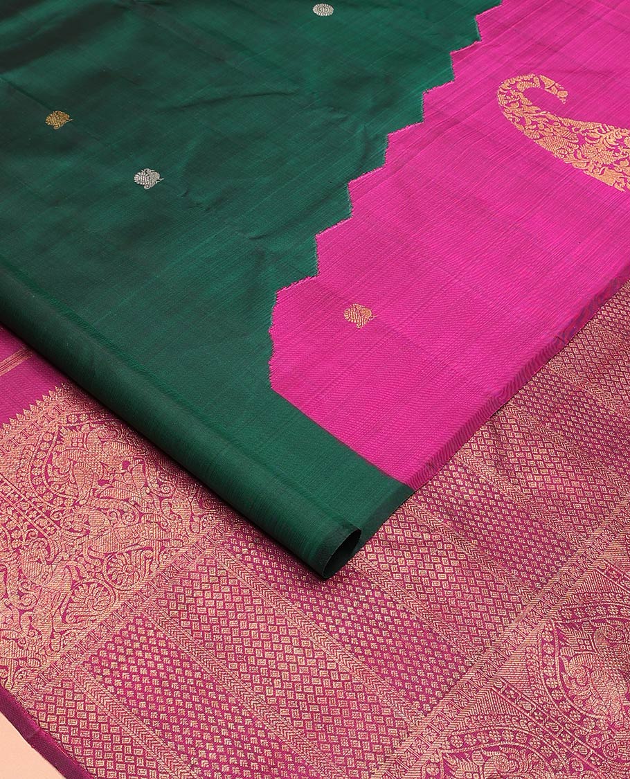 Borderless green and rani pink mayil chakram, and manga motifs Kanchipuram designer saree, zari-rich traditional designs pallu