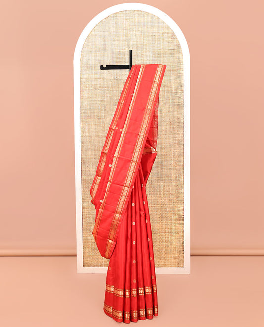 Red Kanchipuram Silk Saree, Woven with Chakram Buttas, a Rettai Pettu Border of Muthu, Banaras, and Cross Kamalam Designs, Mayil-Chakram Pallu, and a Matching Blouse