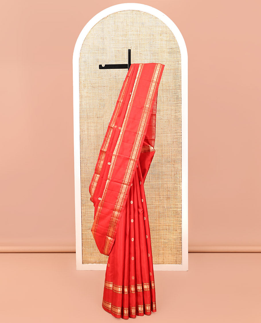 Red Kanchipuram Silk Saree, Woven with Chakram Buttas, a Rettai Pettu Border of Muthu, Banaras, and Cross Kamalam Designs, Mayil-Chakram Pallu, and a Matching Blouse