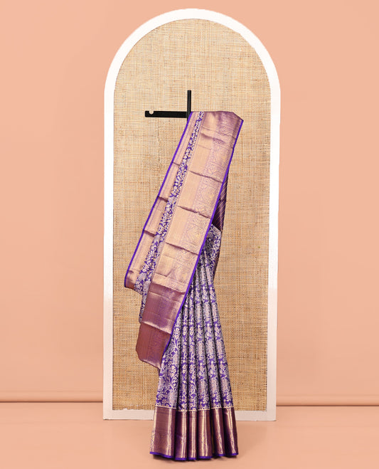 Violet Kanchipuram Tissue Silk Saree, Gracefully Embellished with Floral Jacquard, a Zari Border of Thilakam Mokku, Jaal, and Manga Designs, Diagonal Striped Pallu, and Matching Blouse