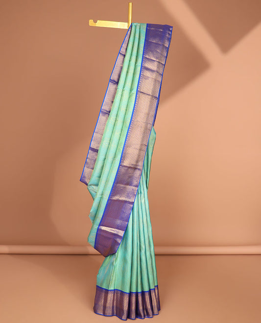 Green intricate floral design kancheepuram silk saree with contrast korvai border of intricate zari design & floral zari design pallu
