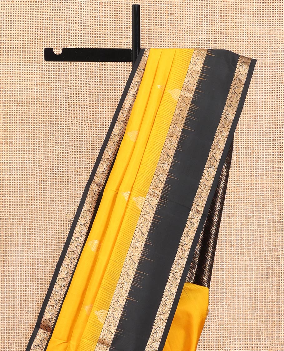 Yellow Mayuri Soft Silk Saree, Subtly Sparkled with Zari Buttas All Over Its Body, Complemented by a Contrast Border of Rekku, Paisa, Manga, and Thazampoo Rekku Designs, Intricately Designed Pallu, and Paired with a Contrast Blouse
