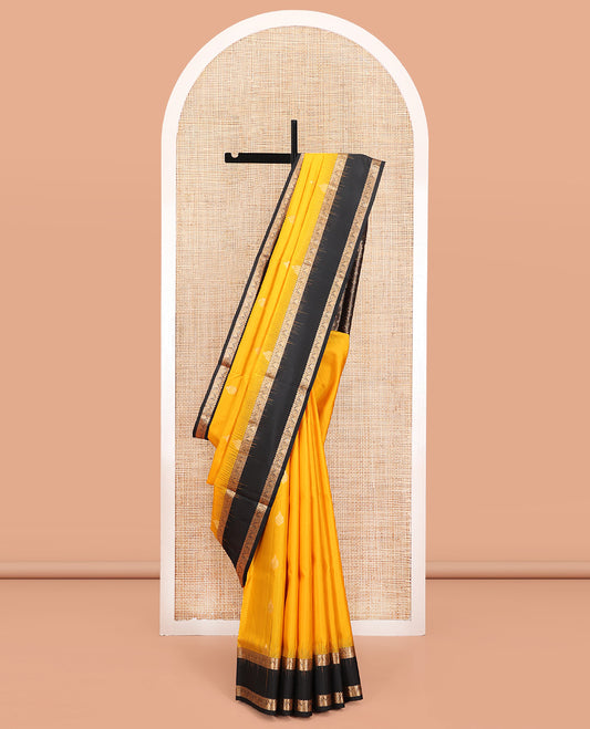 Yellow Mayuri Soft Silk Saree, Subtly Sparkled with Zari Buttas All Over Its Body, Complemented by a Contrast Border of Rekku, Paisa, Manga, and Thazampoo Rekku Designs, Intricately Designed Pallu, and Paired with a Contrast Blouse