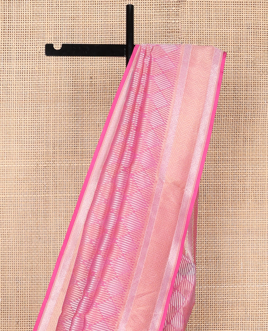 Pink jaal jacquard silk saree, geometric patterned border, and pallu of chevron design