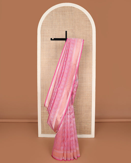 Pink jaal jacquard silk saree, geometric patterned border, and pallu of chevron design