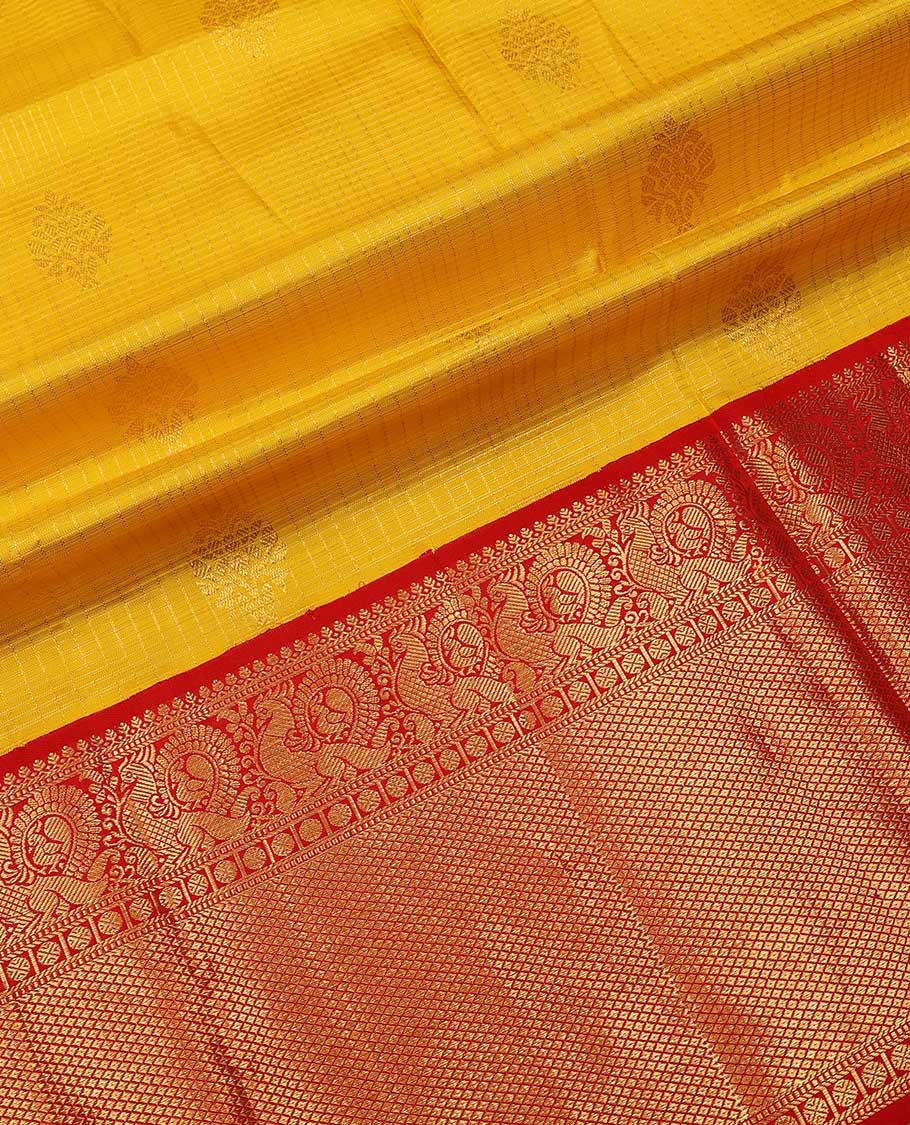 Yellow pure silk half-saree, zari design skirt, contrast korvai border of mayil, rudraksham, and mayil kann designs, and zari bordered blouse, and contrast jaal dhavani