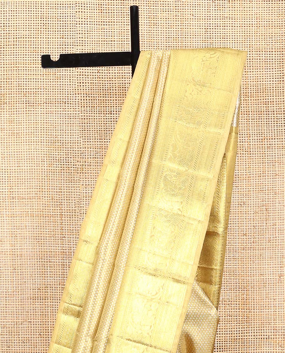 Gold jacquard Kanchipuram tissue silk saree, zari border of thilakam mokku, banaras, muthu, diamond, and kodi visiry designs, and jaal pallu