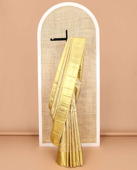 Gold jacquard Kanchipuram tissue silk saree, zari border of thilakam mokku, banaras, muthu, diamond, and kodi visiry designs, and jaal pallu