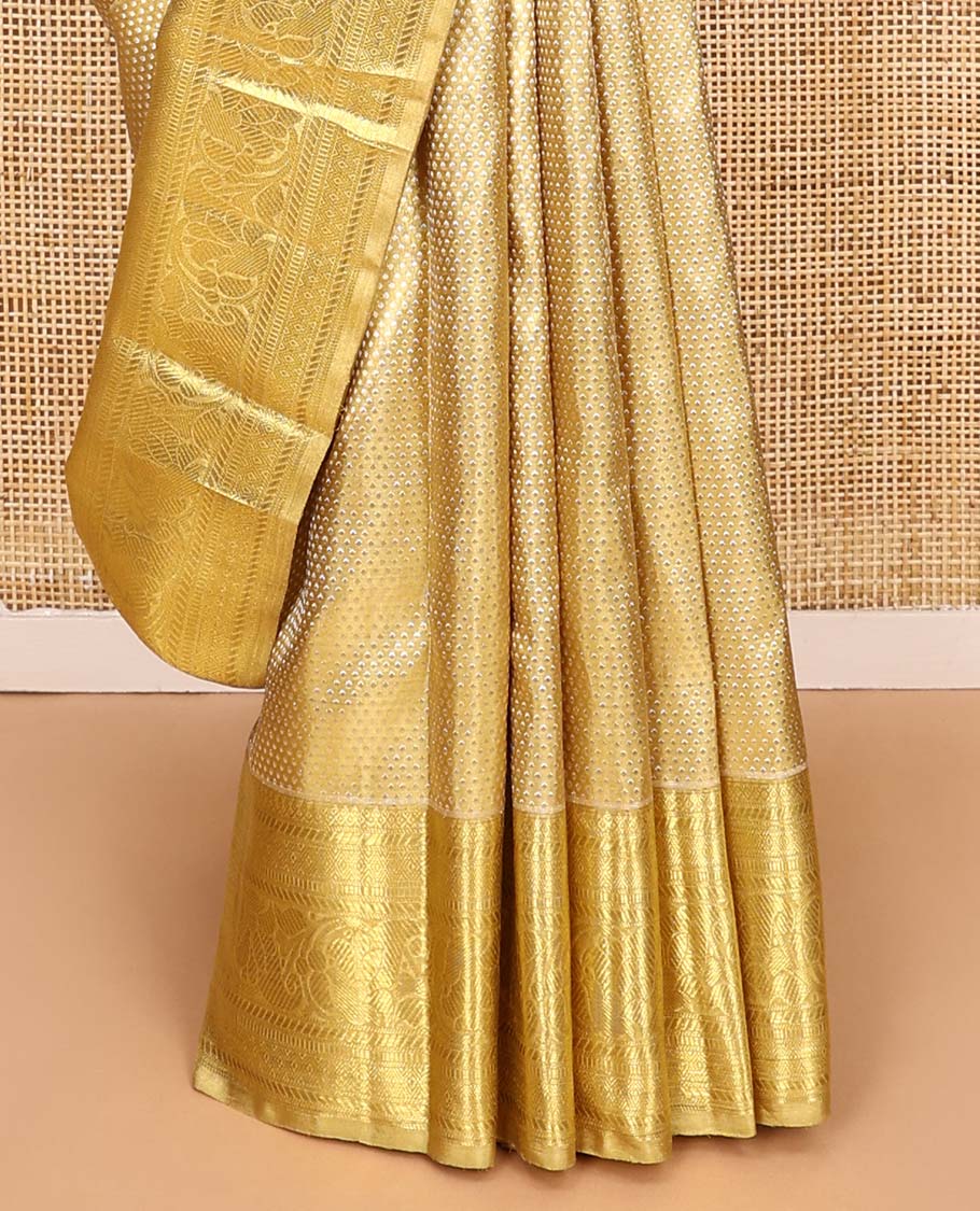 Gold jacquard Kanchipuram tissue silk saree, zari border of thilakam mokku, banaras, muthu, diamond, and kodi visiry designs, and jaal pallu