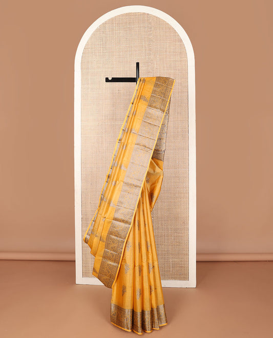 Yellow tussar saree with floral zari buttas, floral design zari border & floral jaal pallu