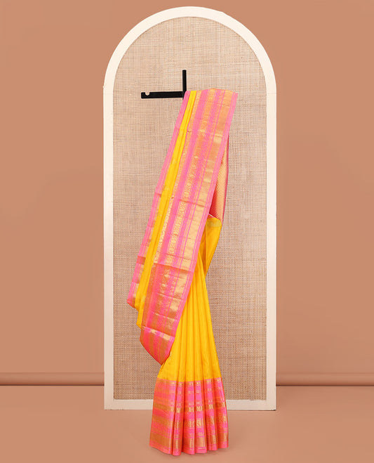 Yellow Venkatagiri Silk Saree, Sparsely Woven with Zari Buttas All Over Its Body, Complemented by a Contrast Border of Temple, Floral, and Peacock-Eye Designs, Pallu of Peacock Eye Designs, and Paired with a Contrast Blouse