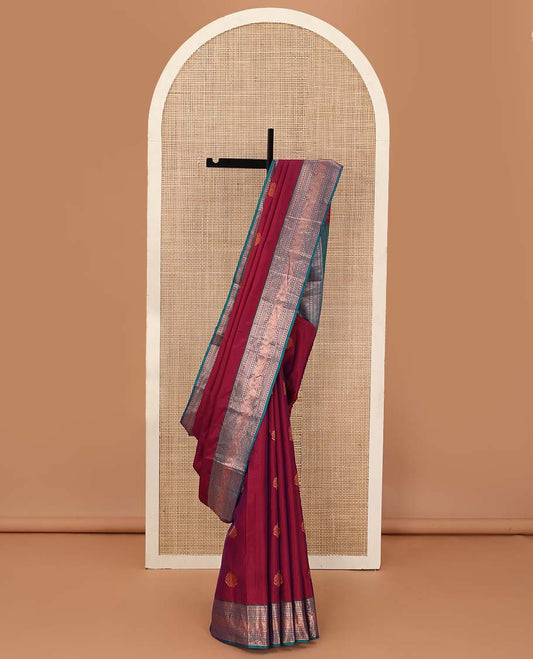 Red zari buttas Vasundhara silk mix saree, contrast border of thilakam mokku, banaras, poun, neli, and mayil design, and zari-rich jaal pallu